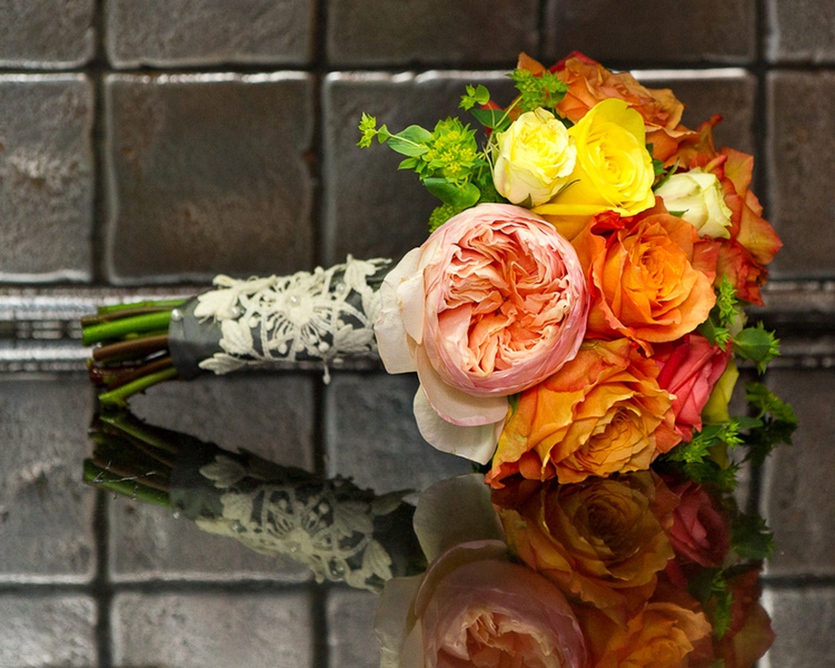 colorful wedding bouquet with vintage lace wrap